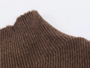 Close-up of deep brown ribbed knit fabric showing soft texture and premium warm material
