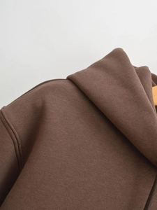 Detailed view of stitching and premium fabric texture on a brown casual hoodie