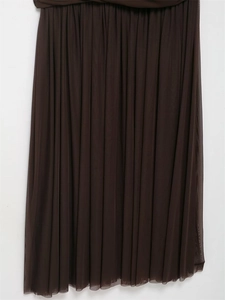 Close-up of pleated dark brown mesh fabric showing detailed texture and transparency