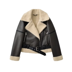 Detailed macro view of vintage brown faux leather jacket with cream faux fur collar and belt