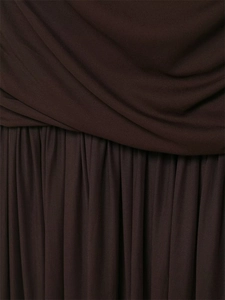 Macro detail of dark coffee pleated fabric with overlapping folds and fine texture