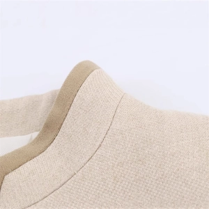 Women's casual beige jacket with brown piping detail and textured knit fabric