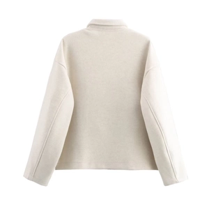 Rear view of cream wool blend jacket featuring drop shoulder design and modern loose fit