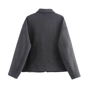 Back view of dark grey oversized wool-like jacket featuring drop shoulder and plush texture