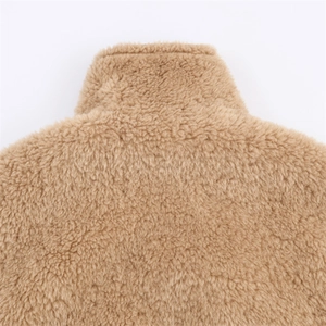 Macro view of plush khaki sherpa fleece jacket collar showing high-quality fiber texture