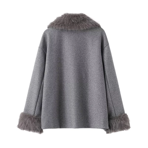 Detail of grey wool coat featuring luxury faux fur trim on collar and cuffs for winter