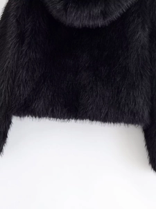 Detail view of premium black faux fur texture on hooded long sleeve zipper jacket