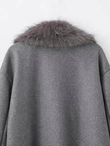 Detailed close-up of the plush faux fur collar on the dark grey wool coat back view