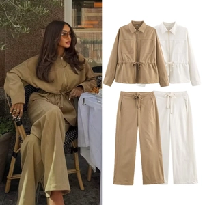 Detail of a women's two-piece cargo set featuring a zipped jacket and wide-leg trousers