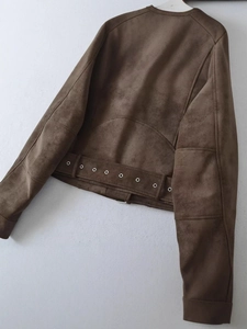 Back view of a cropped brown faux suede biker jacket with decorative belted waist hem