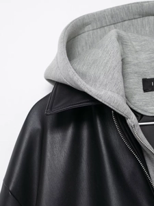 Detail of hooded PU jacket showing high-quality black leather texture and gray knit hood