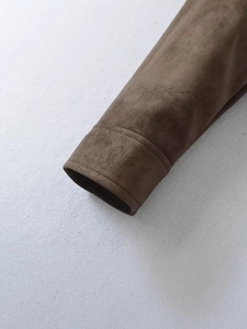 Women's brown faux suede moto jacket showing sleeve cuff detail and fine stitching