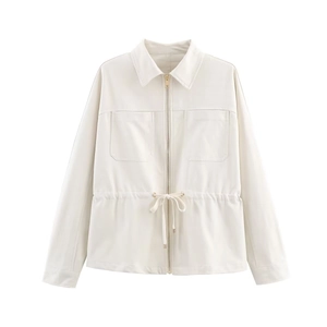 Detail of cream-white adjustable waist jacket with gold metal zipper and large chest pockets