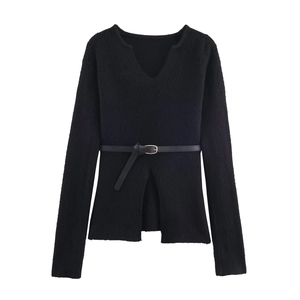 Close-up detail of black V-neck long sleeve knit sweater with matching waist belt