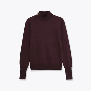 Detail view of burgundy mock neck knit sweater with decorative gold buttons on shoulder