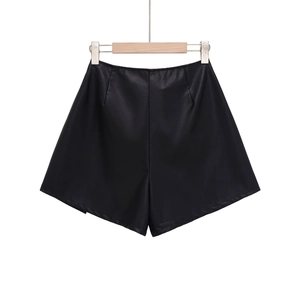 Detailed close-up showing the fine leather texture and stitching on black PU shorts
