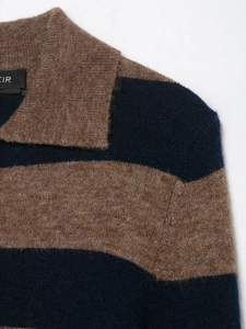 Close-up of striped wool knit sweater texture and collar detail in navy and brown