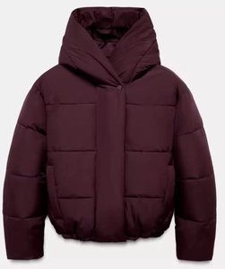 Detail of burgundy hooded puffer jacket with wide horizontal quilting and high collar
