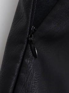 Detail of hidden zipper and matte black drop pull on high-quality black PU leather skirt