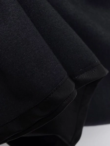 Detailed macro view of the professional hem stitching on high-quality black PU fabric