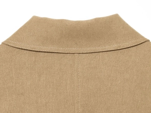 Detail shot of khaki jacket collar featuring durable twill fabric and reinforced stitching