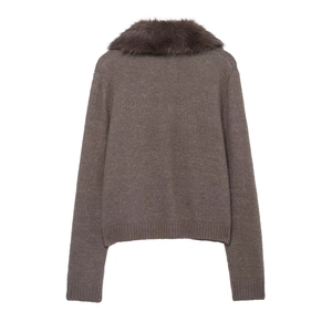 Close-up of the deep brown knitted texture and fluffy faux fur collar on the back of jacket