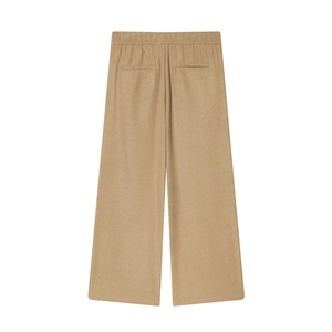 Detail of khaki wide-leg trousers showing elastic waistband and back pocket design