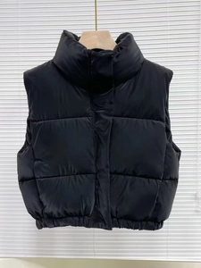 Women's slim fit PU leather puffer vest with stand collar and quilted warm padding in black