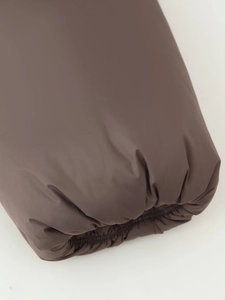 Close-up of elastic ribbed cuffs on a dark brown winter puffer jacket with matte fabric