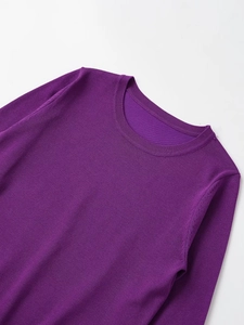 Close-up of the round neckline and soft knitted texture of this purple long-sleeve sweater