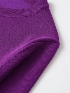 Detail of dark purple knit sweater neck with ribbed texture and high-quality stitching