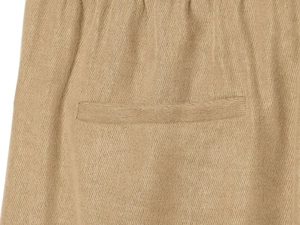Detail shot of khaki textured fabric showing welt pocket and fine stitching on trousers