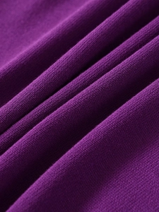 Close-up of soft purple knit fabric texture showing detailed fine plain weave pattern