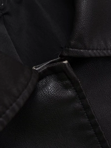 Close-up of premium black PU leather jacket showing collar stitching and grain texture
