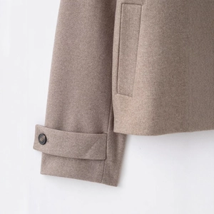 Women's autumn winter wool coat in clay grey with stand collar and buttoned sleeve detail