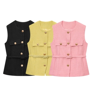 Detail of tweed sleeveless jackets in black, yellow, and pink with gold buttons and belts