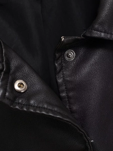 Detailed close-up of collar and silver snap buttons on a black PU leather jacket