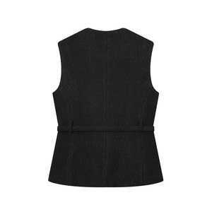 Detail view of black tweed sleeveless vest jacket featuring a back decorative waist belt
