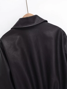 Detailed back view of women's black PU leather jacket showing collar and material texture
