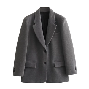 Detailed view of gray wool texture blazer featuring notched lapels and black buttons