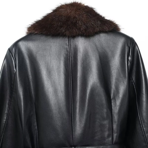 Back view detail of women's long black PU jacket with a detachable brown faux fur collar