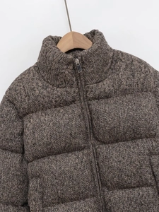 Women's brown tweed knitted puffer jacket with stand collar on wooden hanger