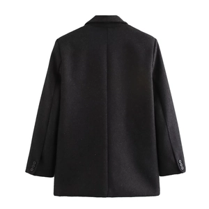 Detailed back view of a black tailored blazer with padded shoulders and cuff buttons