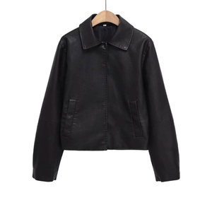 Women's black faux leather jacket with classic lapels and smooth button closure