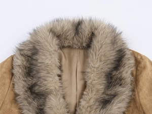 Close-up of brown suede winter jacket featuring a plush faux fur collar and warm texture