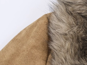Detail of tan faux suede jacket with premium thick grey faux fur collar trim
