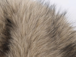 Macro shot of faux fur texture in tan and black for autumn winter jacket collar