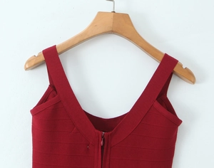 Detail of dark red knit dress with ribbed texture, V-neckline and front zipper closure