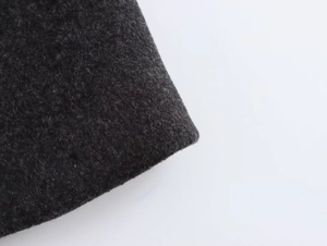 Close-up of premium dark grey wool blend fabric texture for autumn winter blazer