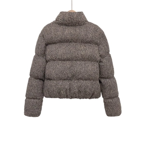Detail view of heather grey tweed texture on thick padded stand collar winter jacket